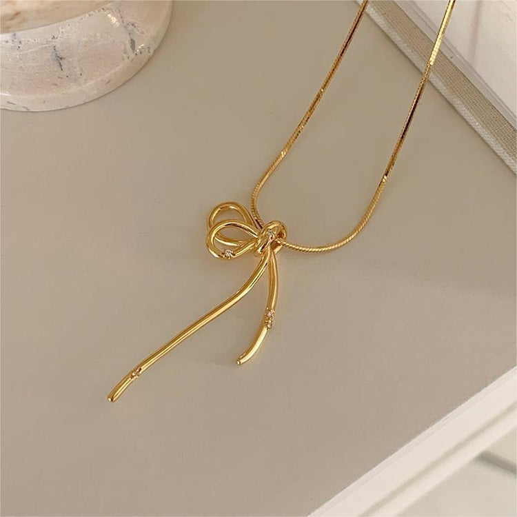 GOLD BOW NECKLACE