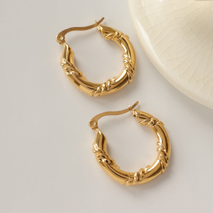 TWIST TUNNEL EARRINGS